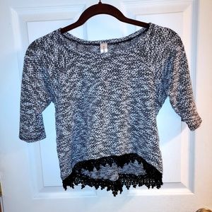 A gray and white t-shirt, size medium